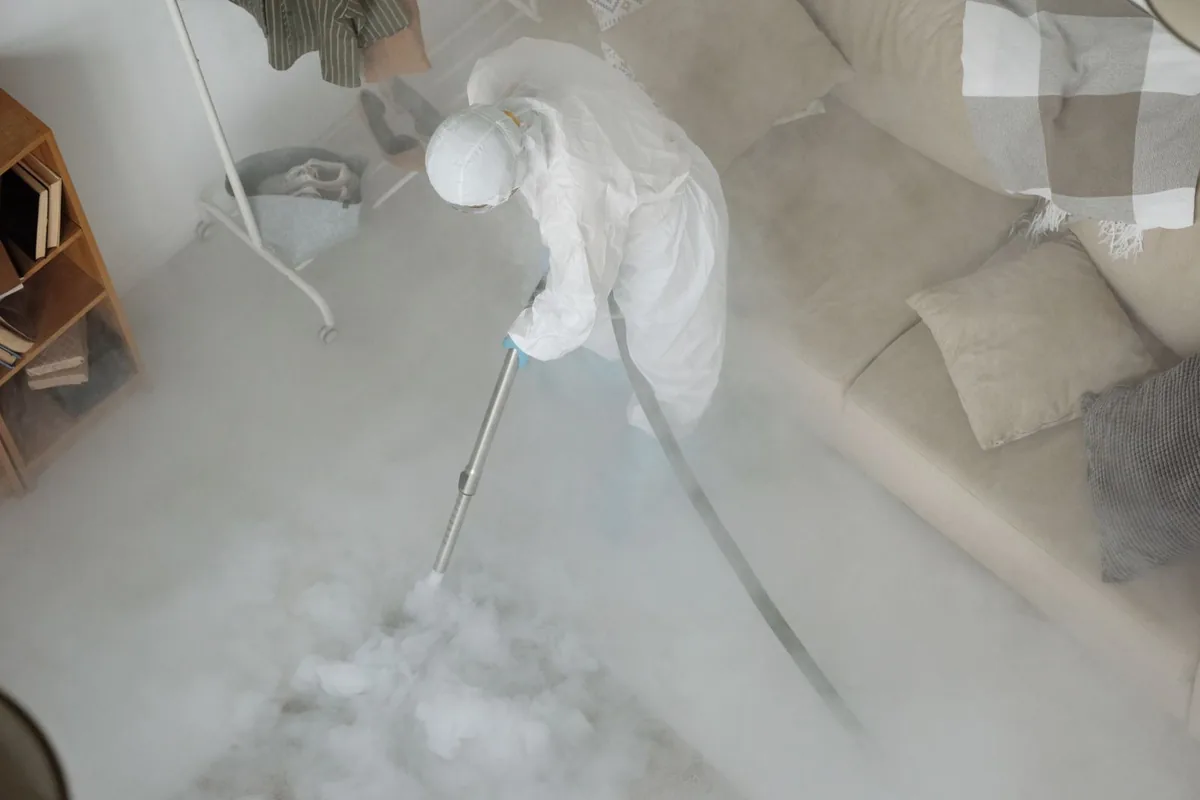 Biohazard cleanup technician in protective equipment, Ken Caryl, CO